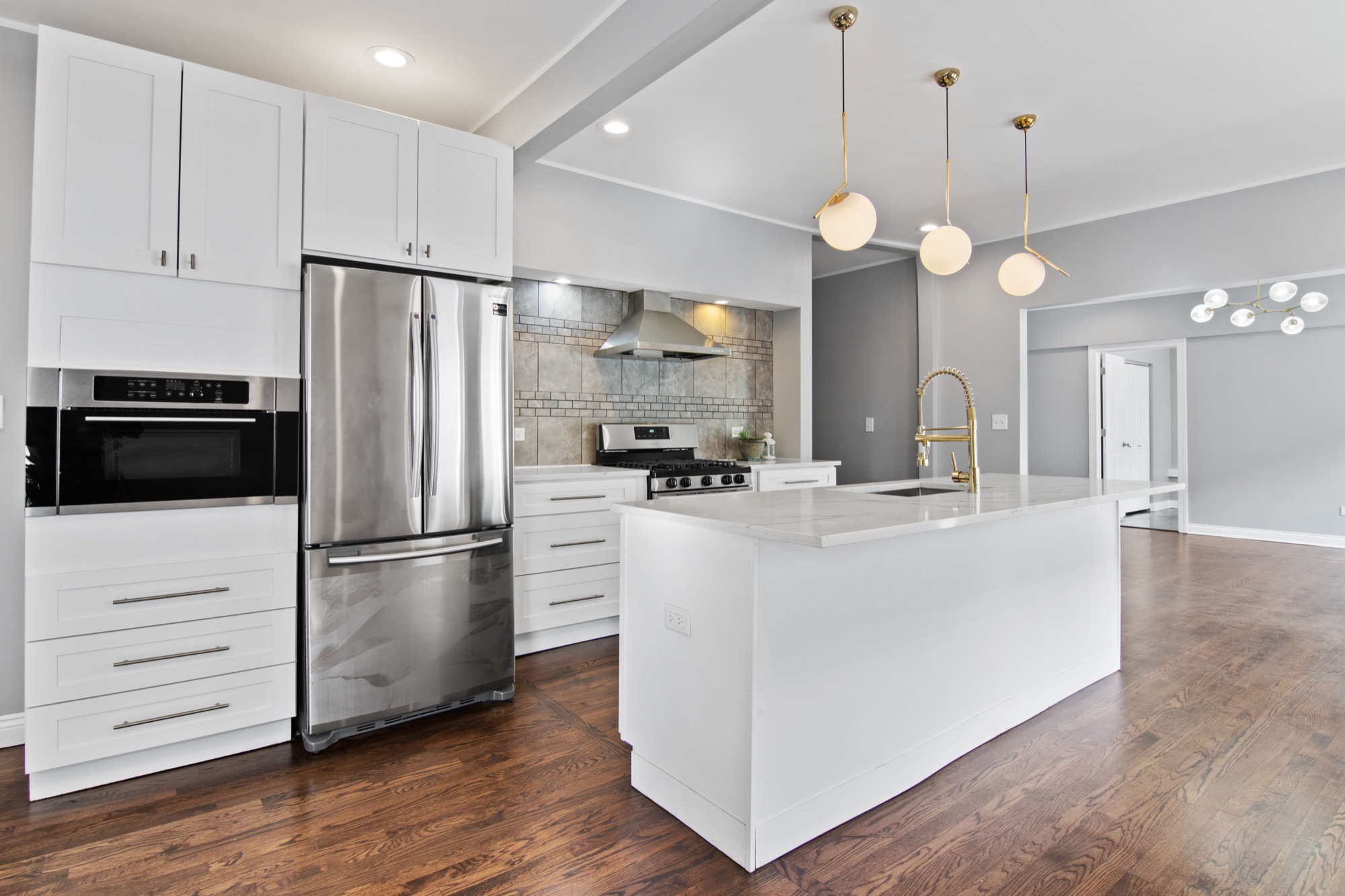 Kitchen with shaker cabinets at the suburban gut rehab