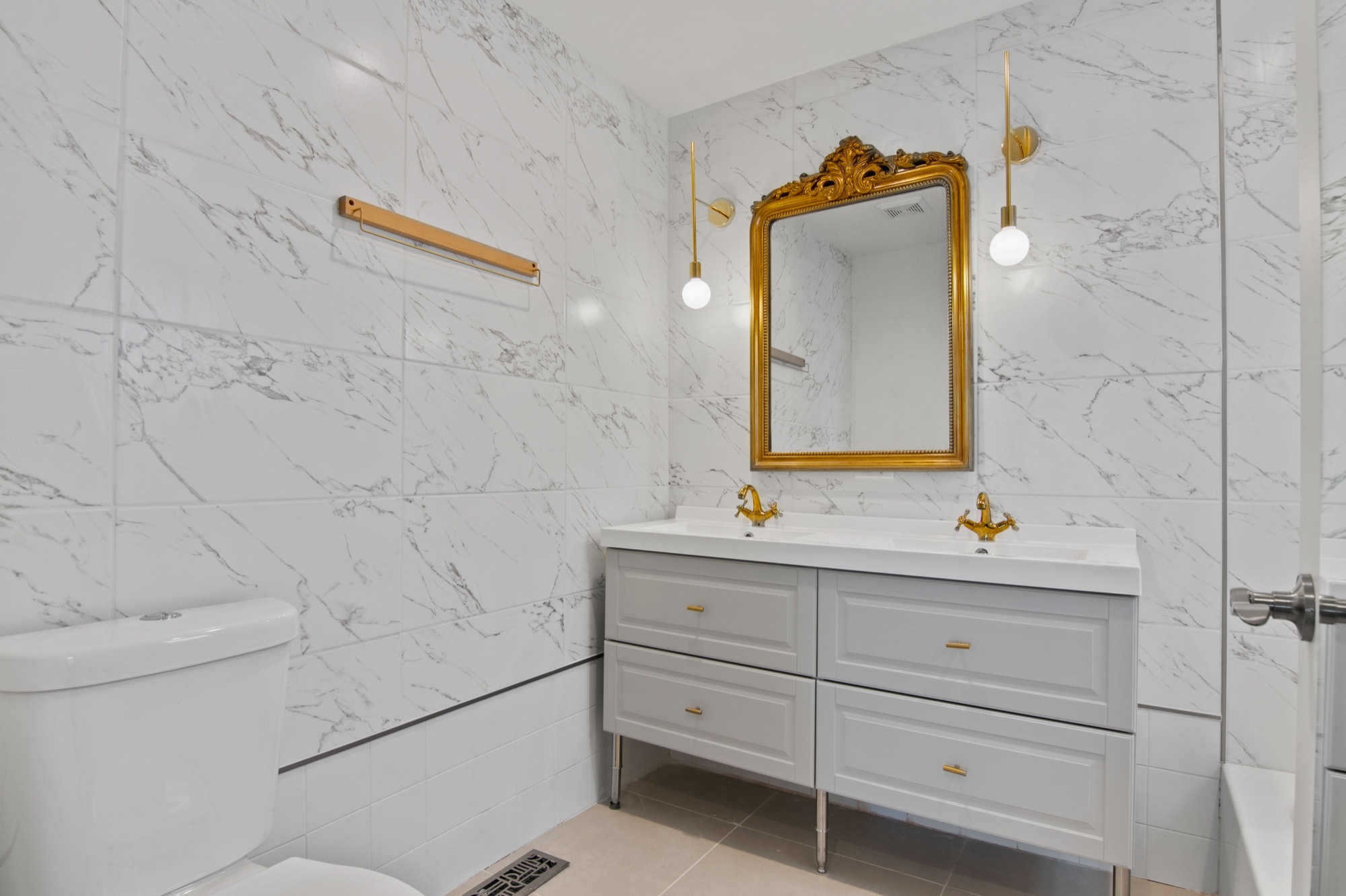 Marble subway tile walls and porcelain floor at a suburban Chicago primary bath